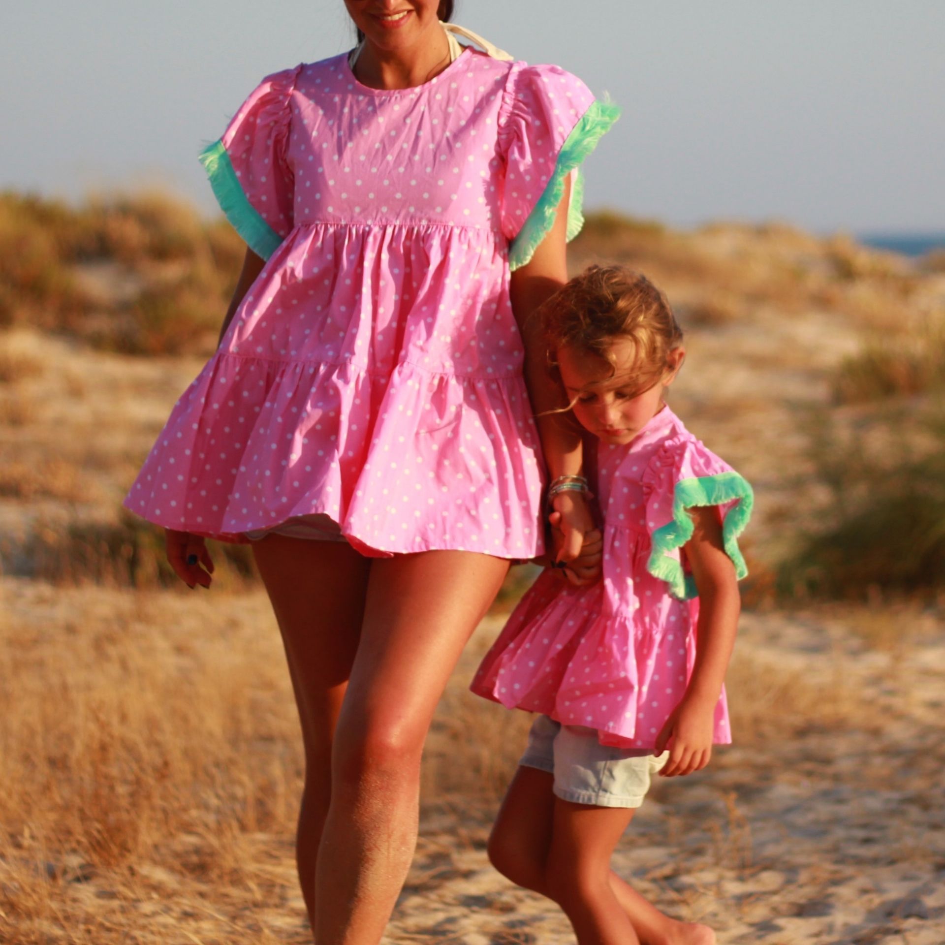 Tunica rosa bolas franja verde