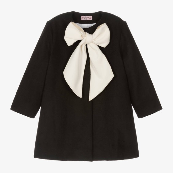 Black coat with ivory bow