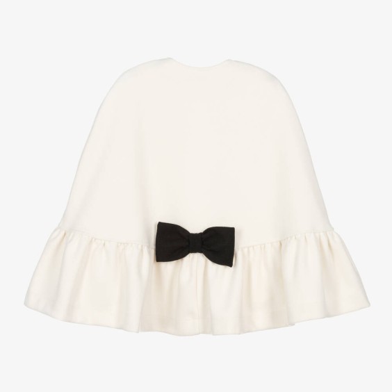 Ivory cape with black bow