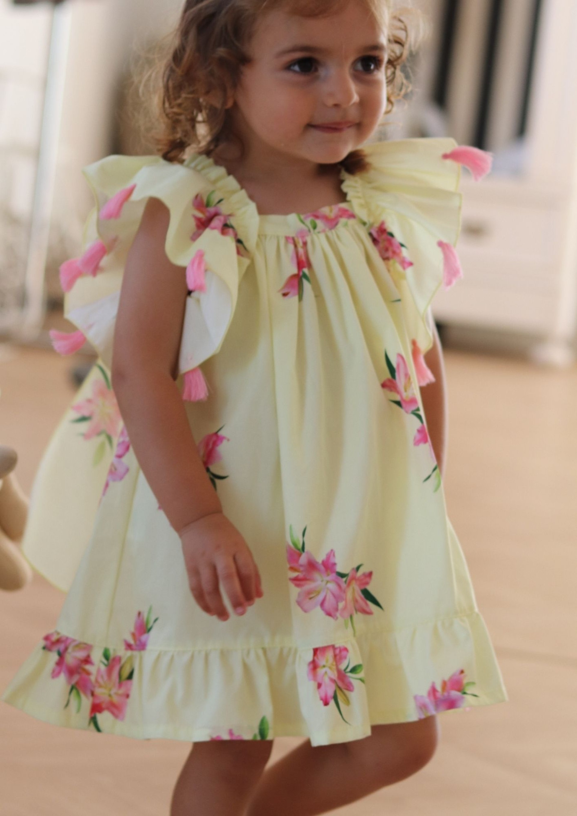 Lilies dress with pink pompom