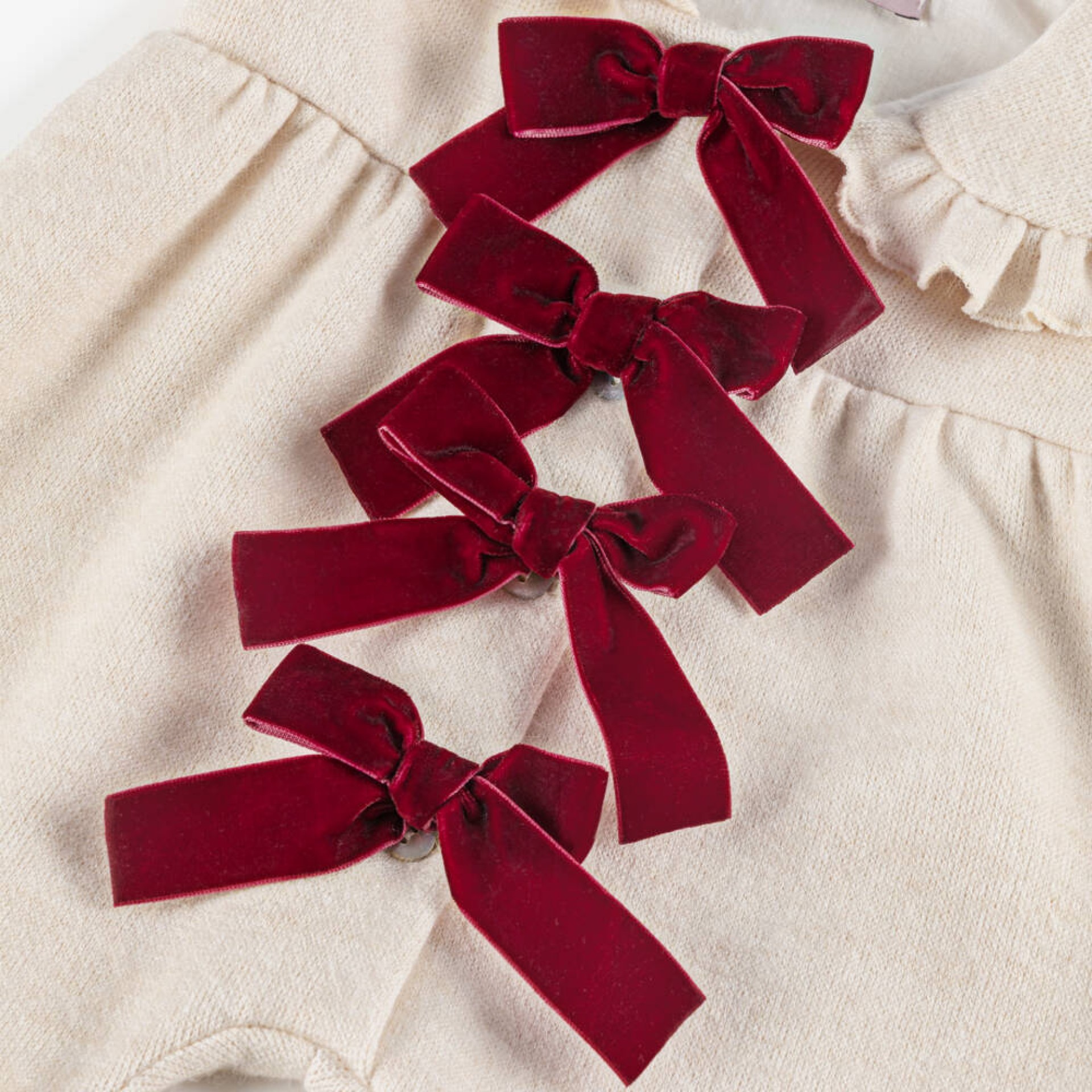 Ivory jumpsuit with burgundy bows