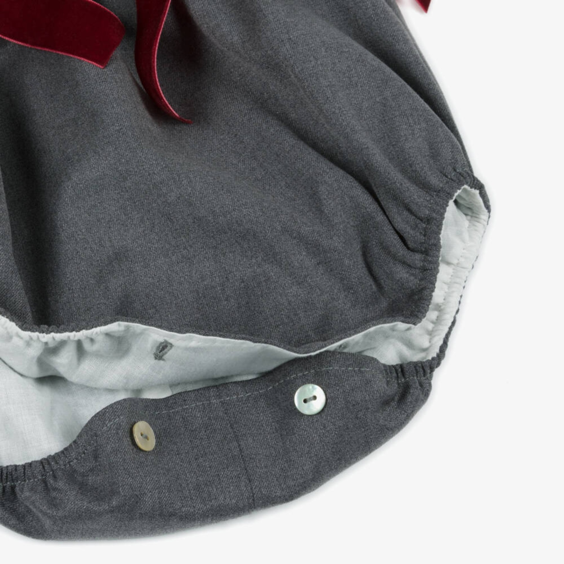 Grey romper with pleats and burgundy velvet bows