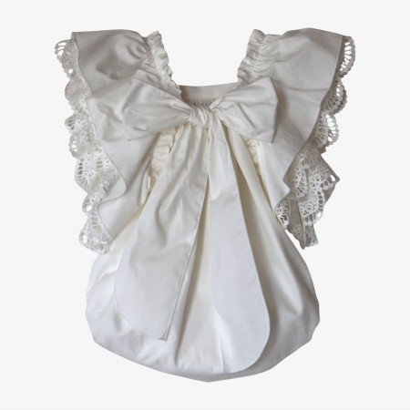Ivory romper with a bow