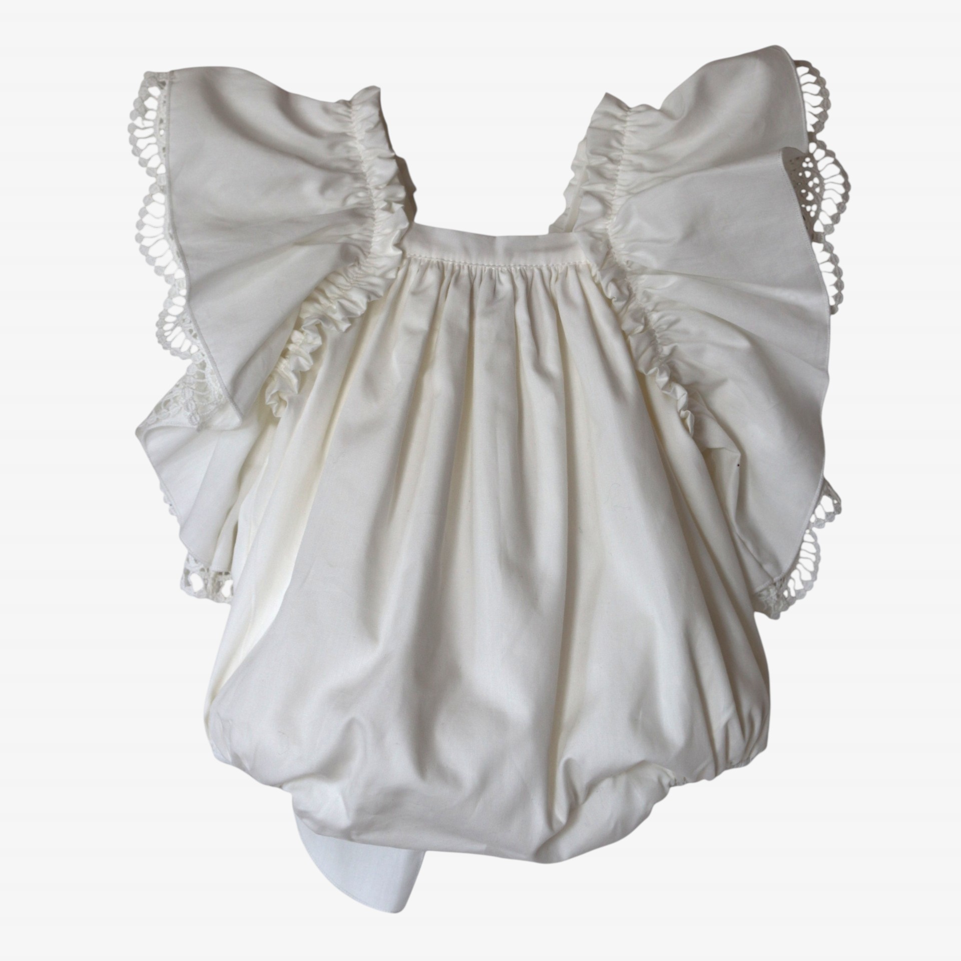 Ivory romper with a bow