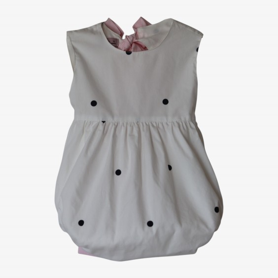 Black polka dots romper with a pink bow