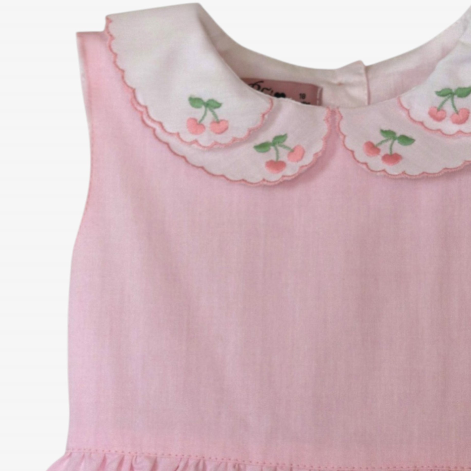 Pink romper with a collar embroidered with cherries