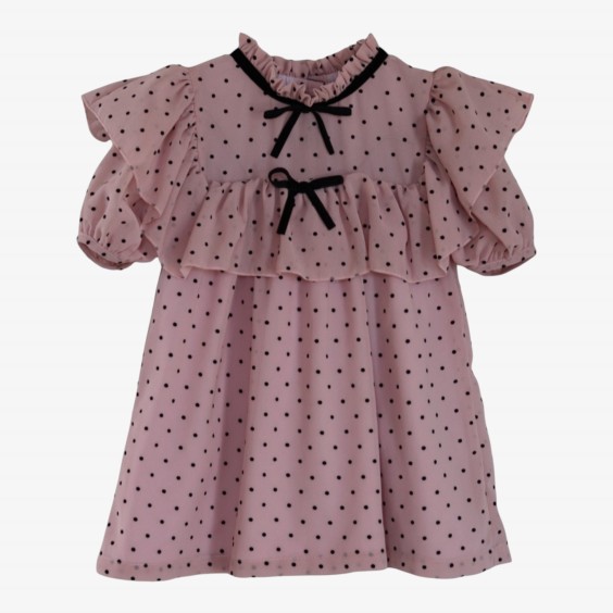Pink voile dress with polka dots and a bow.