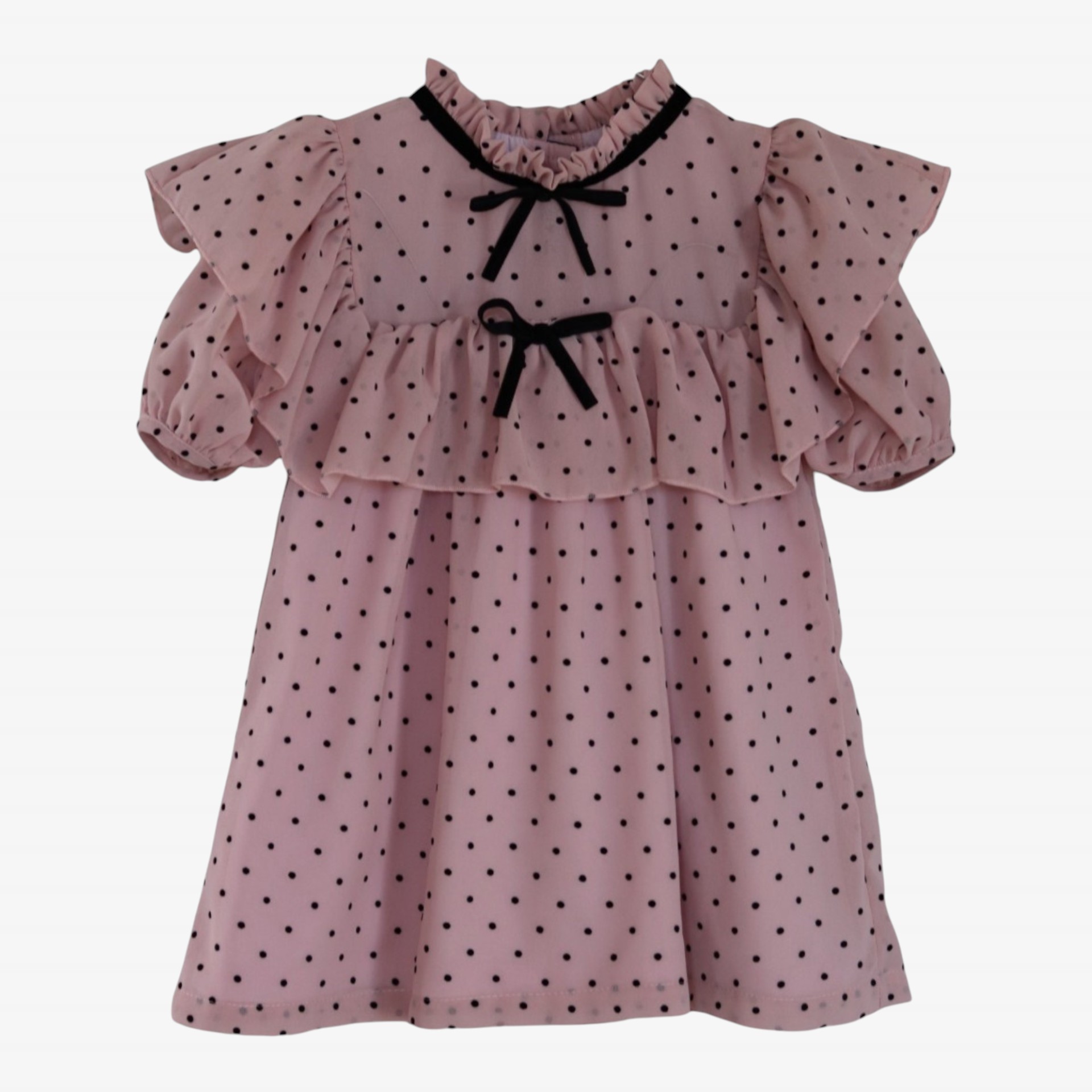Pink voile dress with polka dots and a bow.