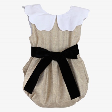 Golden linen romper with a black velvet bow.