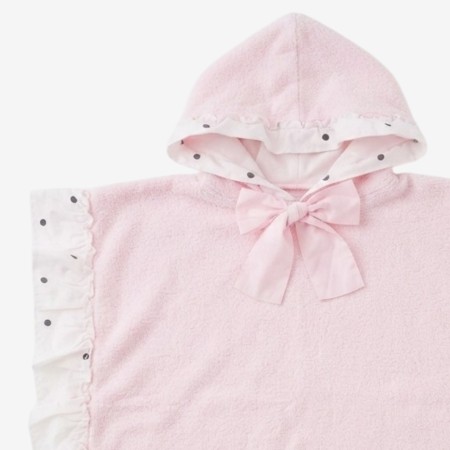 Poncho with black polka dots and a pink bow Poncho with black polka dots and a pink bow