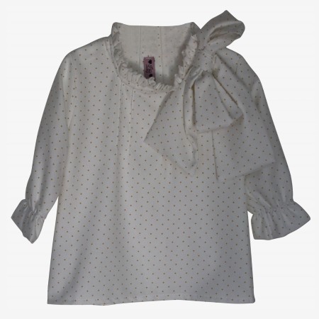 Ivory blouse with burnt yellow spots and a bow.
