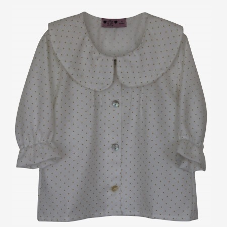 Ivory blouse with burnt yellow spots.