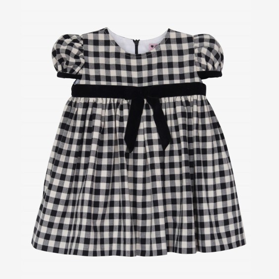 Black and cream square dress with black velvet bow.