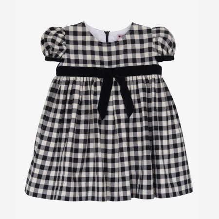 Black and cream square dress with black velvet bow.