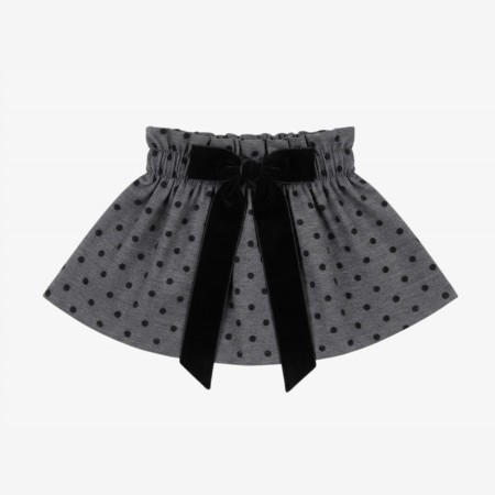 Black skirt with black velvet polka dots and a bow.