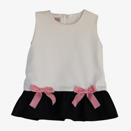 Ivory and black dress with pink bows. Ivory and black dress with pink bows.