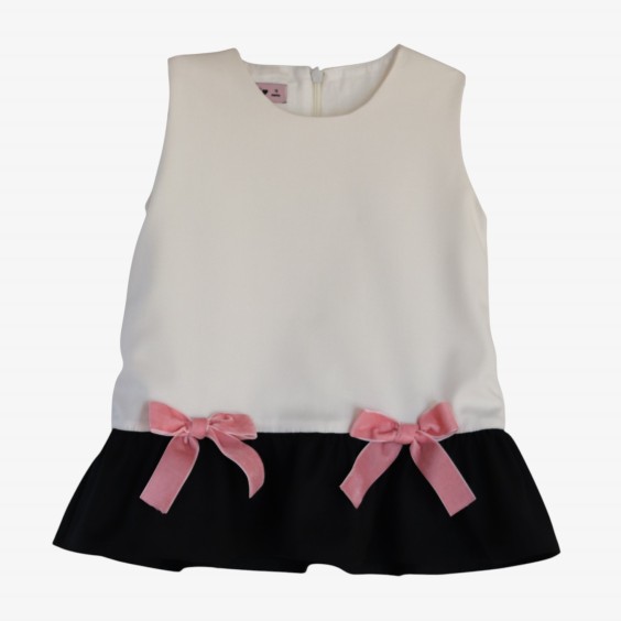 Ivory and black dress with pink bows.