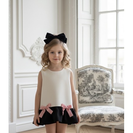Ivory and black dress with pink bows. Ivory and black dress with pink bows.