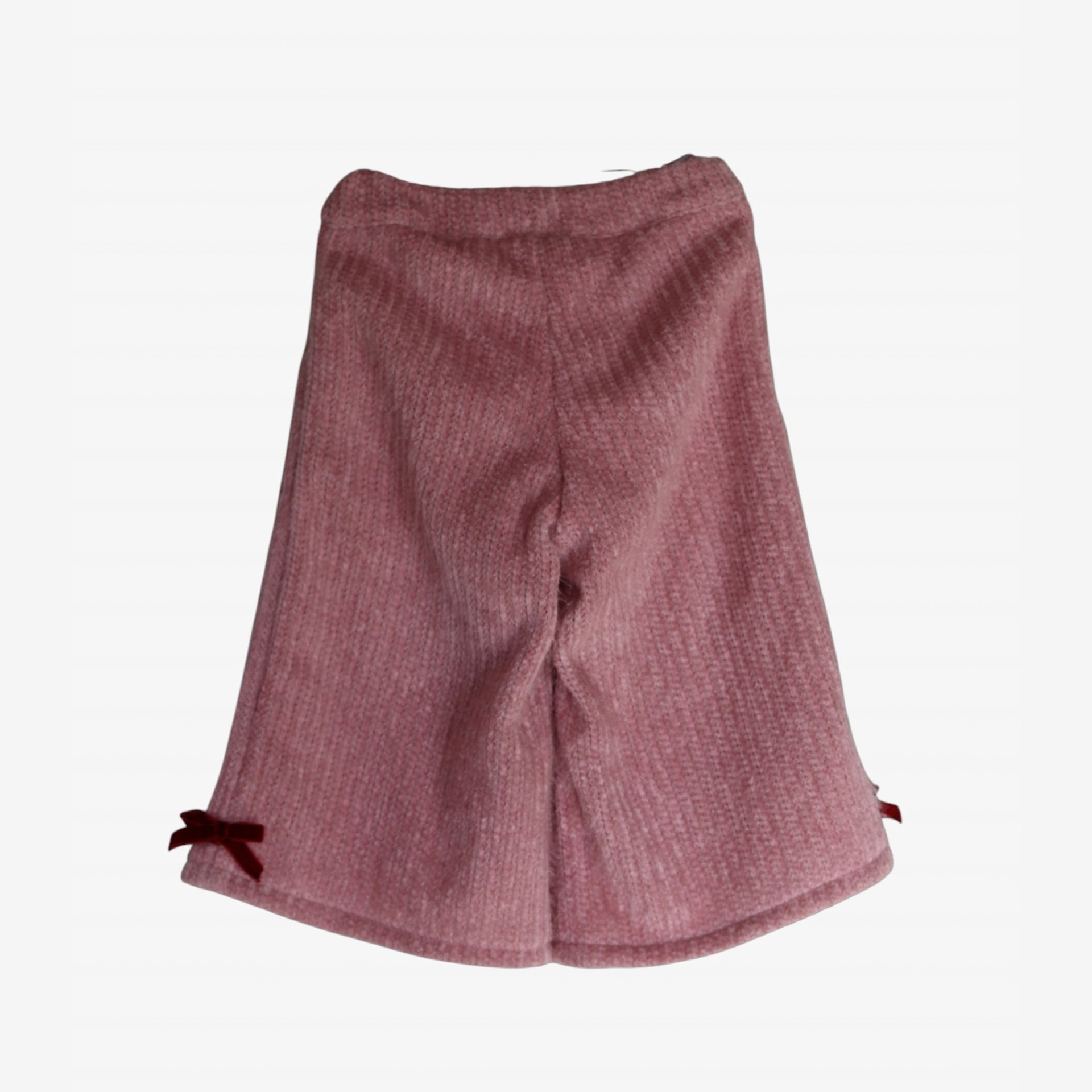 Pantalon en maille rose avec des nœuds bordeaux