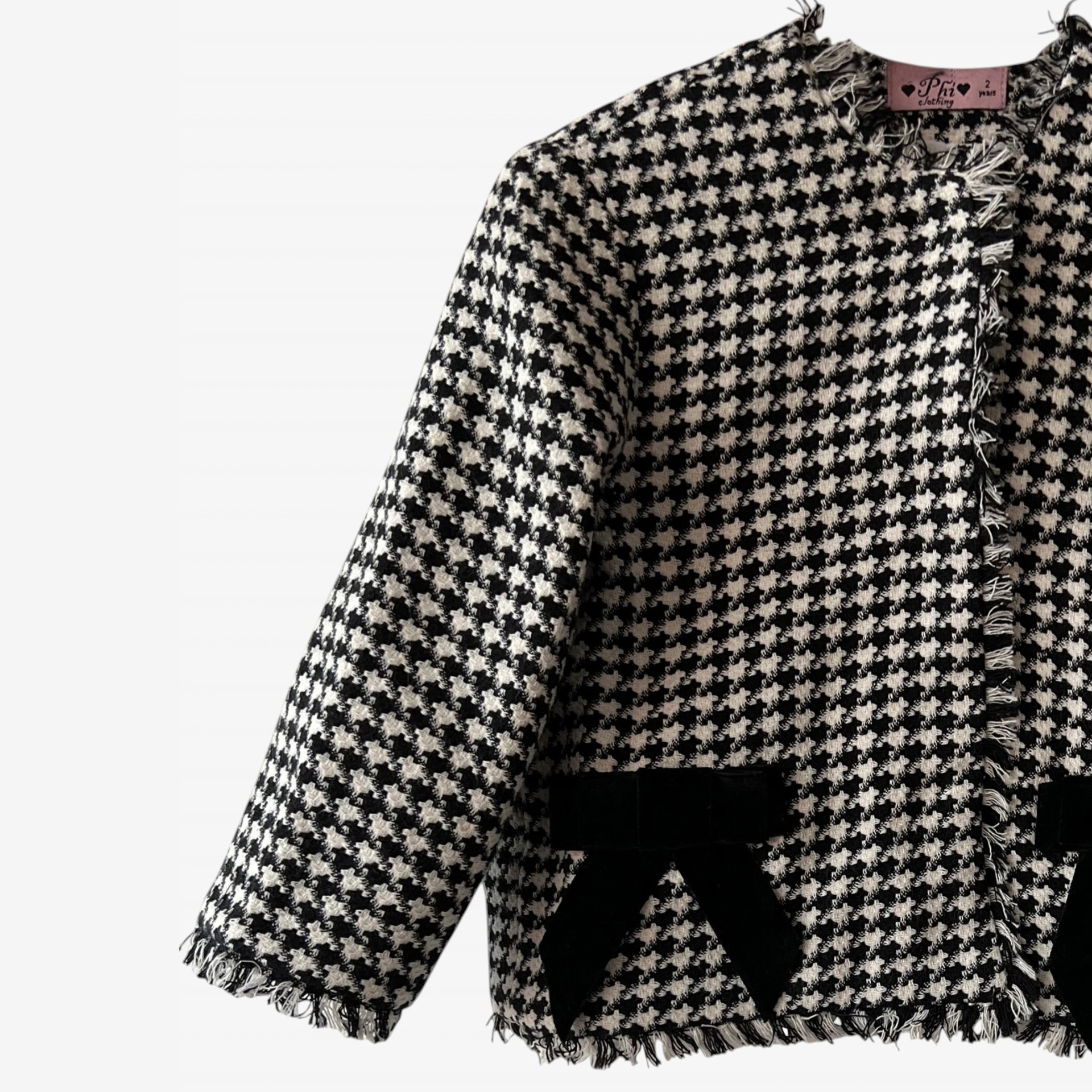 Black and white houndstooth coat