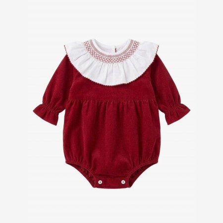 Burgundy velvet romper with a smocked collar.