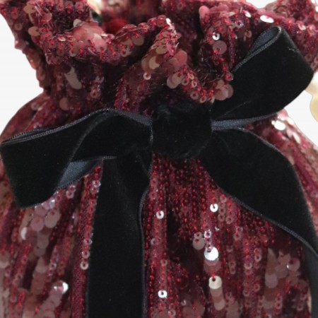 Burgundy sequined bag with black velvet bow. Burgundy sequined bag with black velvet bow.